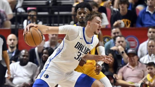 Dallas Mavericks forward Cooper Flagg (32) drives the ball against Los Angeles Lakers guard Bronny James (9) during the first half of an NBA summer league basketball game Thursday, July 10, 2025, in Las Vegas. (AP Photo/David Becker) 
