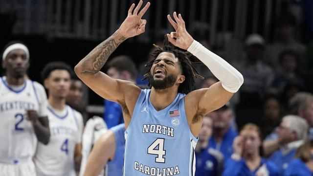North Carolina guard RJ Davis (4) celebrates after his team scored during the first half of an NCAA college basketball game against Kentucky in the CBS Sports Classic, Saturday, Dec. 16, 2023, in Atlanta, Ga. (AP Photo/Brynn Anderson)