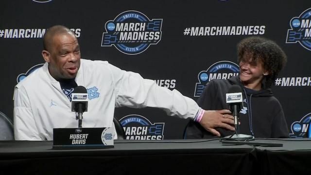 UNC coach Hubert Davis and son Micah talk at a press conference on March 27, 2024.