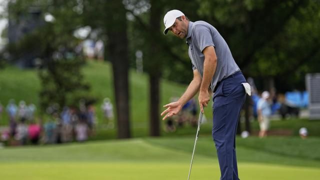 Scottie Scheffler reacts after missing a putt on the 10th hole during the second round of the PGA Championship golf tournament at the Quail Hollow Club, Friday, May 16, 2025, in Charlotte, N.C. (AP Photo/George Walker IV)