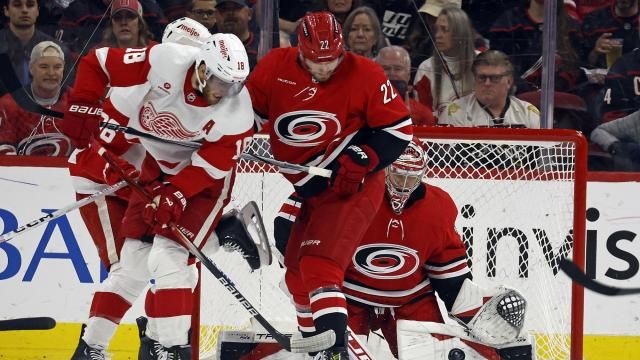 Carolina Hurricanes goaltender Frederik Andersen cleans up the puck behind teammate Brett Pesce (22) and Detroit Red Wings' Andrew Copp during the second period of an NHL hockey game in Raleigh, N.C., Thursday, March 28, 2024. (AP Photo/Karl B DeBlaker)