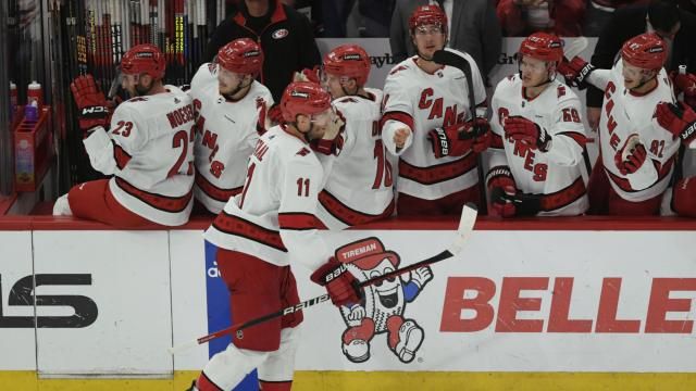 Carolina Hurricanes' Jordan Staal (11) celebrates with teammates on the bench after scoring during the second period of an NHL hockey game against the Chicago Blackhawks, Sunday, April 14, 2024, in Chicago. (AP Photo/Paul Beaty)