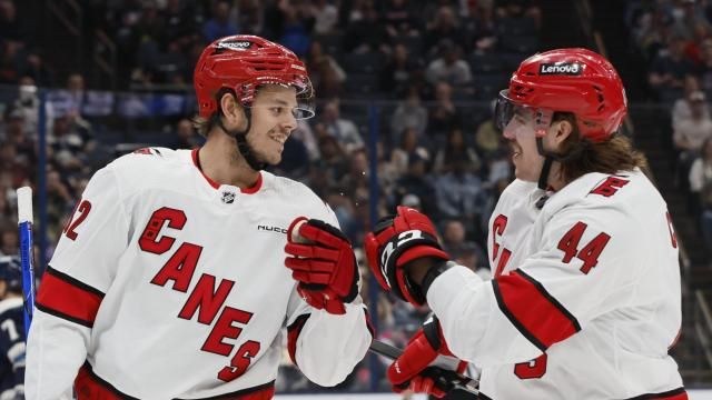 Carolina Hurricanes' Jesperi Kotkaniemi, left, and Maxime Comtois celebrate their goal against the Columbus Blue Jackets during the first period of an NHL hockey game Tuesday, April 16, 2024, in Columbus, Ohio. (AP Photo/Jay LaPrete)