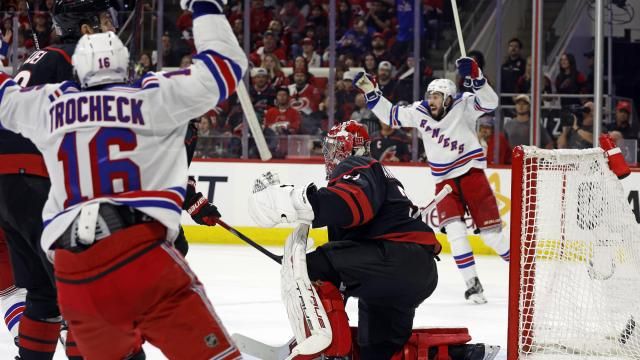 New York Rangers' Mika Zibanejad, back right, and Vincent Trocheck (16) celebrate a goal by Chris Kreider on Carolina Hurricanes goaltender Frederik Andersen during the third period in Game 6 of an NHL hockey Stanley Cup second-round playoff series in Raleigh, N.C., Thursday, May 16, 2024. (AP Photo/Karl B DeBlaker)